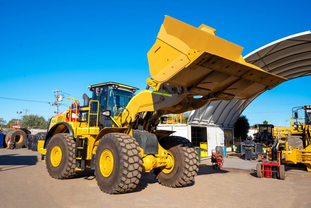 Clean wheel loader cooling pack to maintain airflow and efficiency