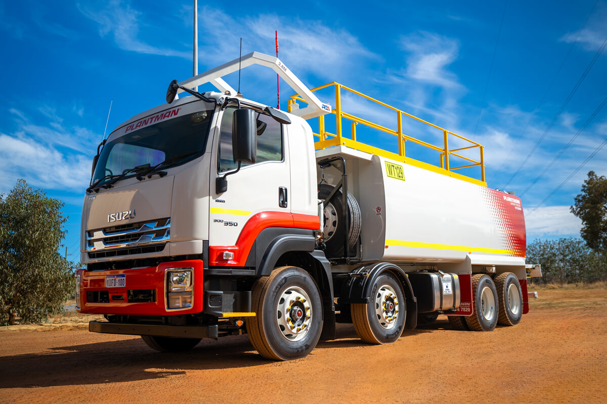 A Plantman Water Truck vehicle on a sunny day with blue skies